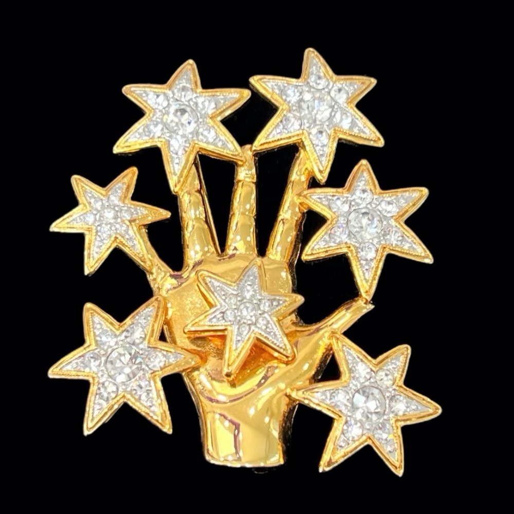 NOLAN MILLER SHINY GOLDEN HAND WITH CRYSTAL STARS BROOCH